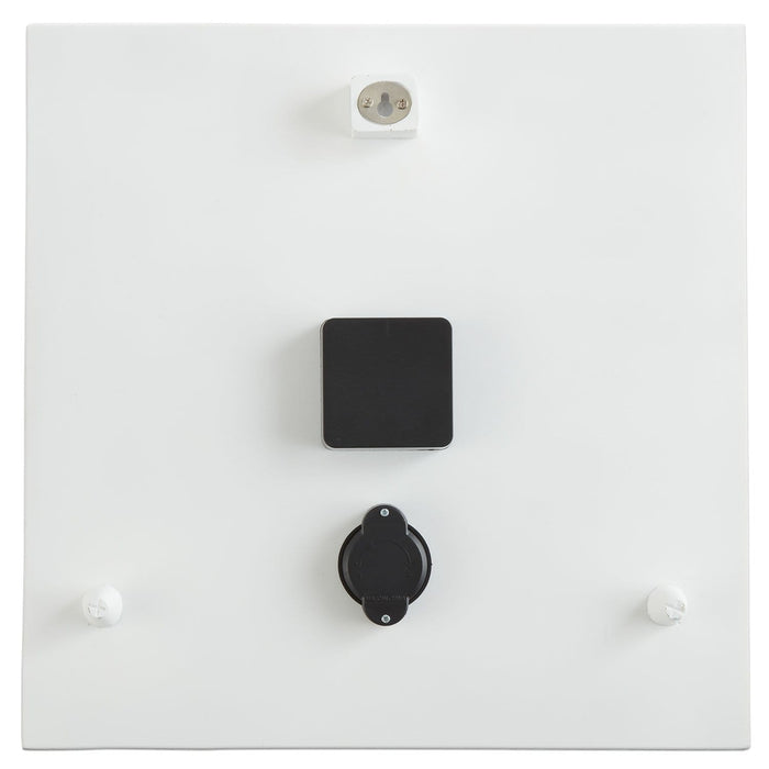 Back view of a white square wall clock with a black mounting plate and top power outlet.