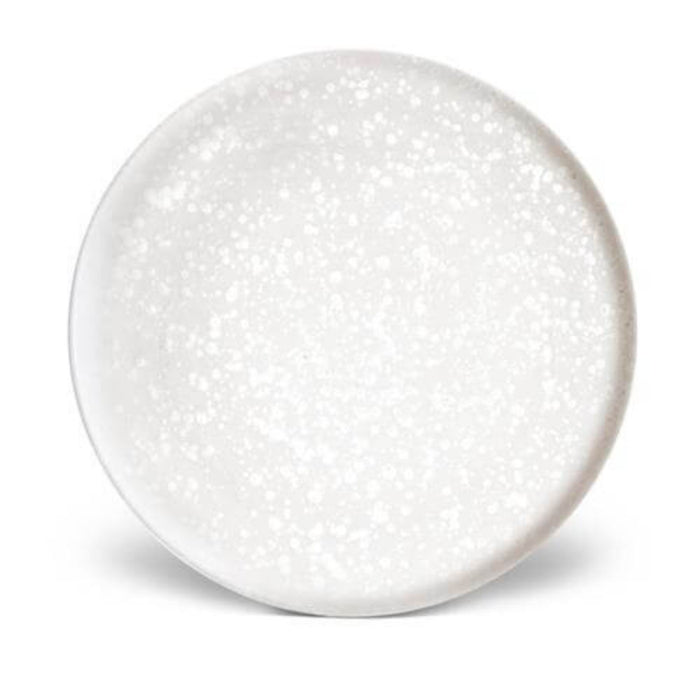 The Alchimie Dinnerware White by L'Objet is a round, white ceramic plate with a subtle speckled pattern, designed as luxury tableware and displayed against a plain white background.