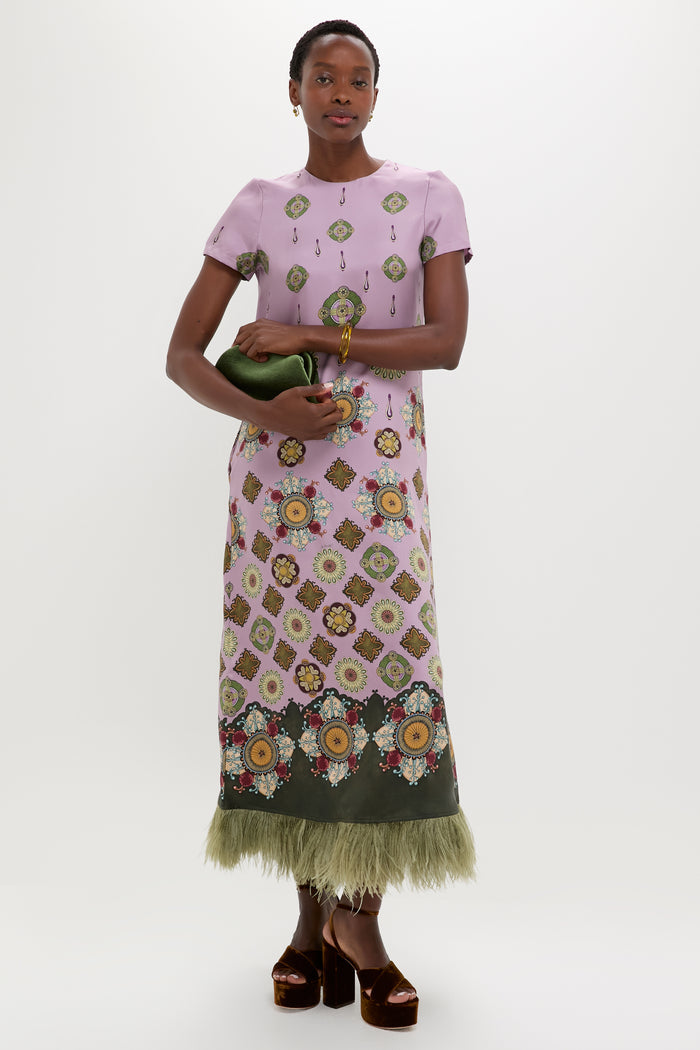 Model in a classic, floor-length lilac dress holds an Apple Ridge Cuff, a fun and effortless marbled pink resin bangle, embodying high-end style.