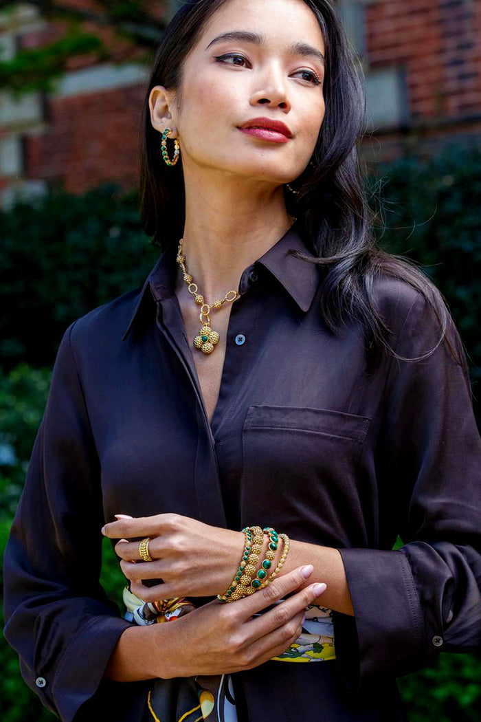 Berry Gem Petite Hinged Bangle - Malachite shines with classic elegance, featuring green malachite and gold beads, adding an effortless, high-end touch to any outfit.