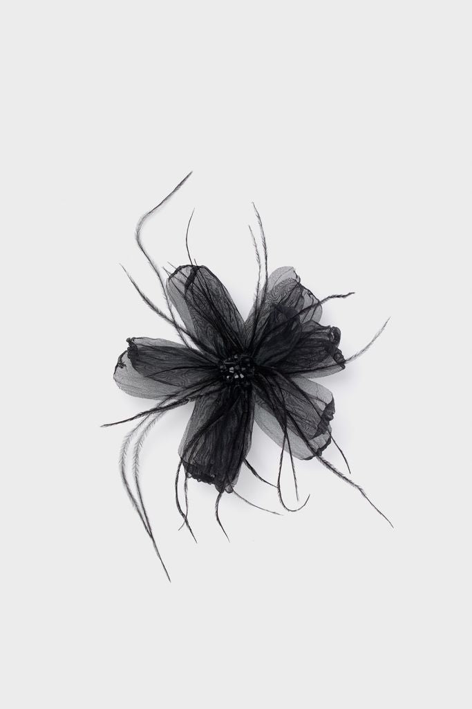 Black Embellished Feather Floral Pin with layered petals, beaded center, and feathery tendrils; a classic, high-end accessory for an effortless, fun statement look.