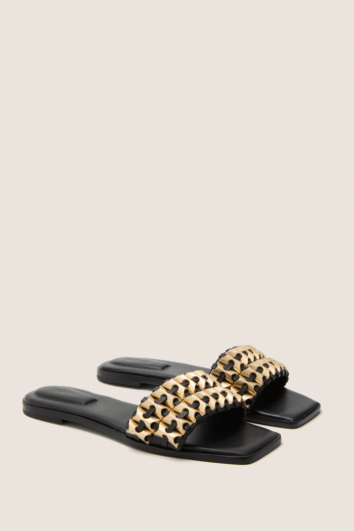 Black Faye Beaded Leather Flat Slides with a classic slip-on design, featuring a woven lattice strap with gold-tone beading. Effortless and high-end, perfect for fun outings.