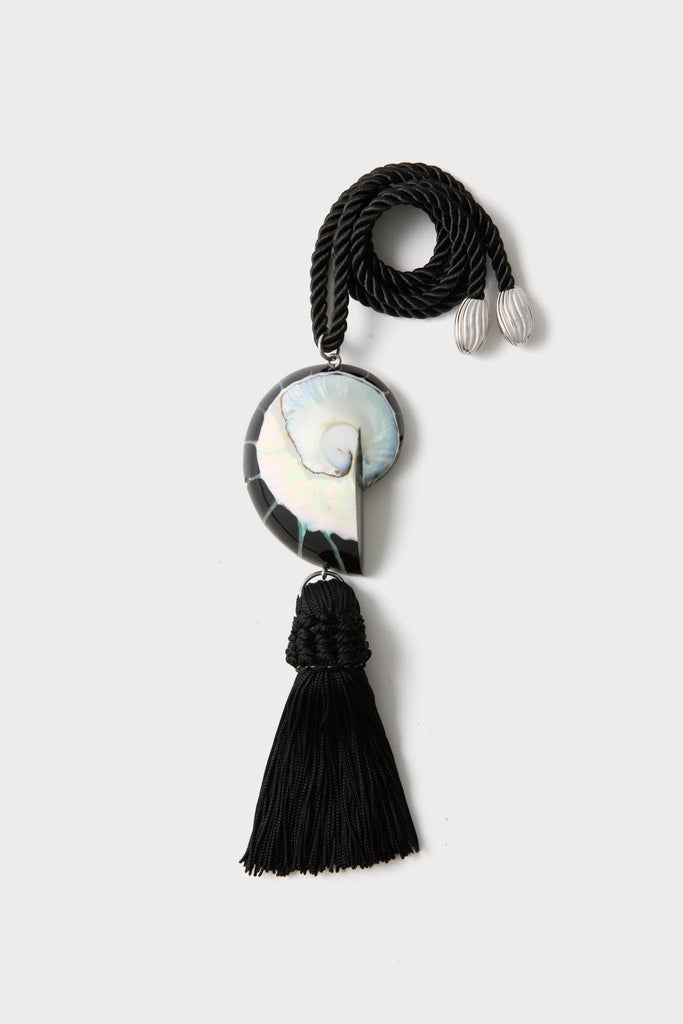 Black Nautilus Necklace: A classic, high-end accessory featuring a twisted black rope with silver-tone caps, iridescent spiral shell pendant, and an effortless black tassel, perfect for fun occasions.