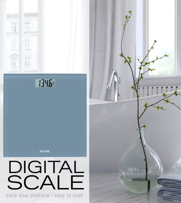 Slate blue digital scale with a rectangular display showing 134.6 lb