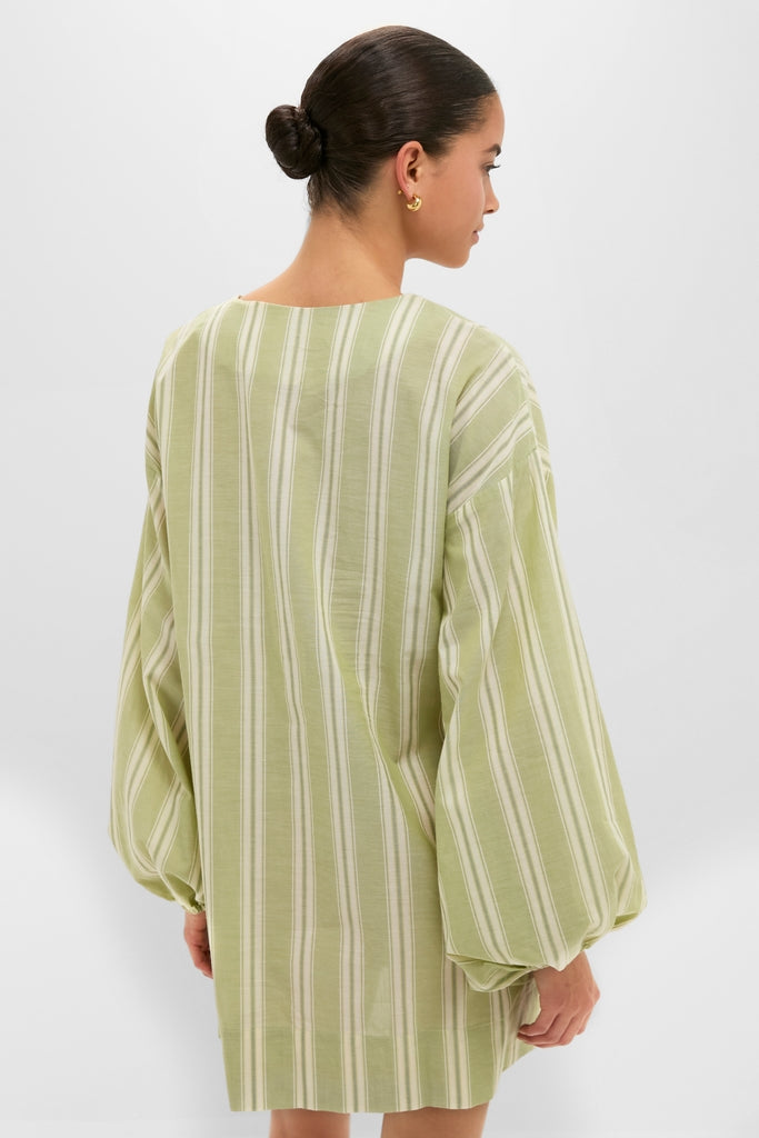 Person wearing Faded Juniper Ombre Stripe Pia Mini Dress with billowy sleeves and relaxed fit, embodying classic, effortless high-end style perfect for fun, easy resort wear.