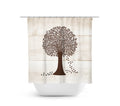 Shower curtain with three light brown wood planks as the background with a medium brown tree with foliage in a round shape and leaves falling from the right side of the tree.