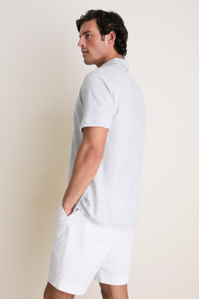 Man in Gale Gray Linen Sanibel Polo, showcasing a classic, effortless look with lightweight, high-end fabric, perfect for fun, sun-soaked adventures.