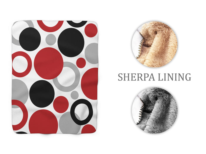 Geometric Dot Sherpa Fleece Blanket with Red, Black, & Gray Abstract circles and rings on a white background.