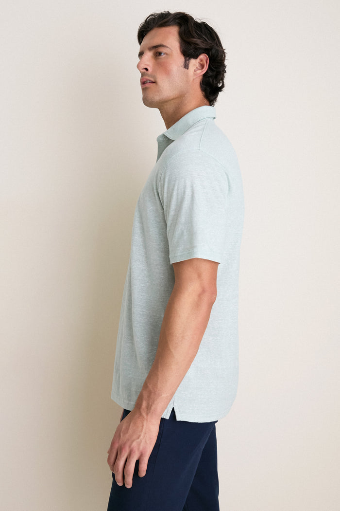 Young man in profile wearing a classic, light-mint-green Grandview Linen Sanibel Polo, embodying effortless, high-end style for fun, everyday adventures.