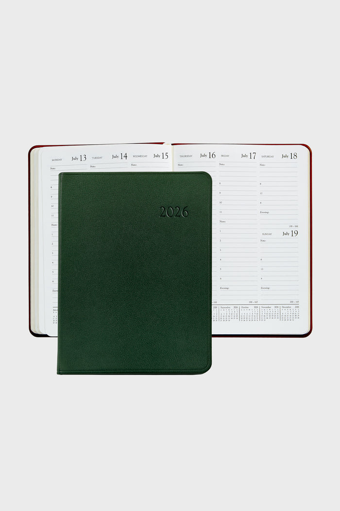 Green Traditional Leather Desk Diary with embossed “2026” cover, featuring a weekly layout from July 13-19. Classic design with lined slots, notes section, and mini-calendars, for effortless planning.