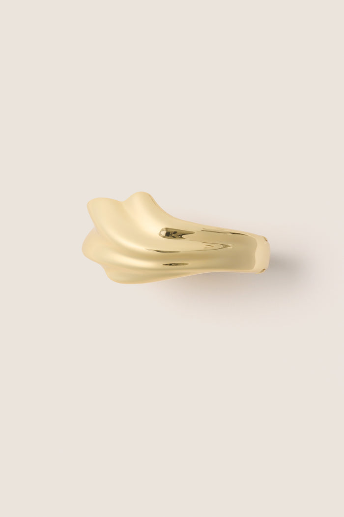 High polish gold Lydia Cuff, a fluid, abstract form exuding classic elegance and effortless style, perfect for fun and high-end fashion statements.