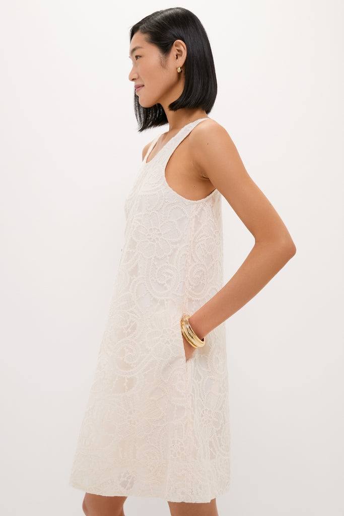 Ivory Lace Organza MaryLiza Swing Dress features a classic scoop neck and pockets, styled effortlessly with gold jewelry for a fun, high-end look.