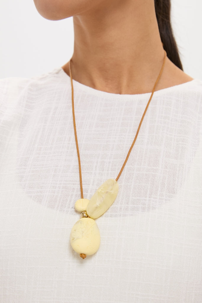 Lemon Brass Rock Cluster Pendant on a classic, effortless thin leather cord, featuring three smooth resin beads for a fun, high-end, modern look.