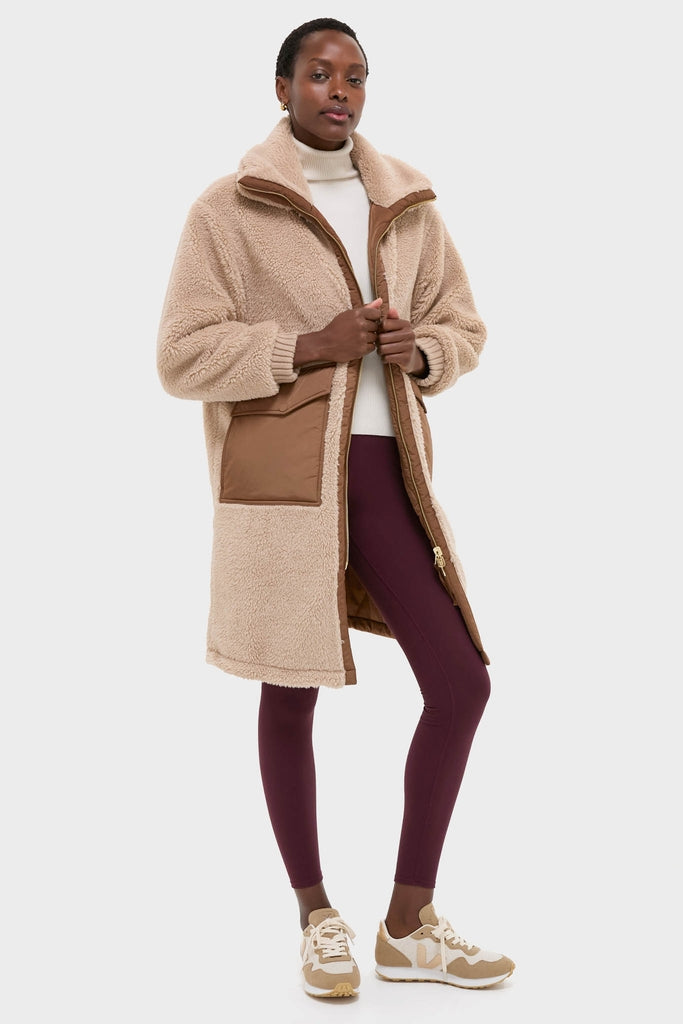 Classic and high-end Light Taupe and Cocoa Dust Theia Reversible Coat styled effortlessly with a turtleneck, fitted leggings, and sneakers for fun, cozy, cool-weather wear.