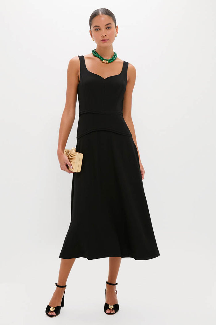 Model wearing the Malachite Double Strand Celine Necklace, effortlessly paired with a fitted black dress, showcasing a classic, high-end look that’s fun and versatile.