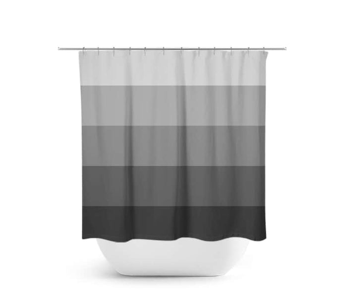 shower curtain with gray gradient stripes with the lightest gray stripe at the top of the curtain and the darkest gray stripe at the bottom of the curtain. There are 5 stripes on the curtain.