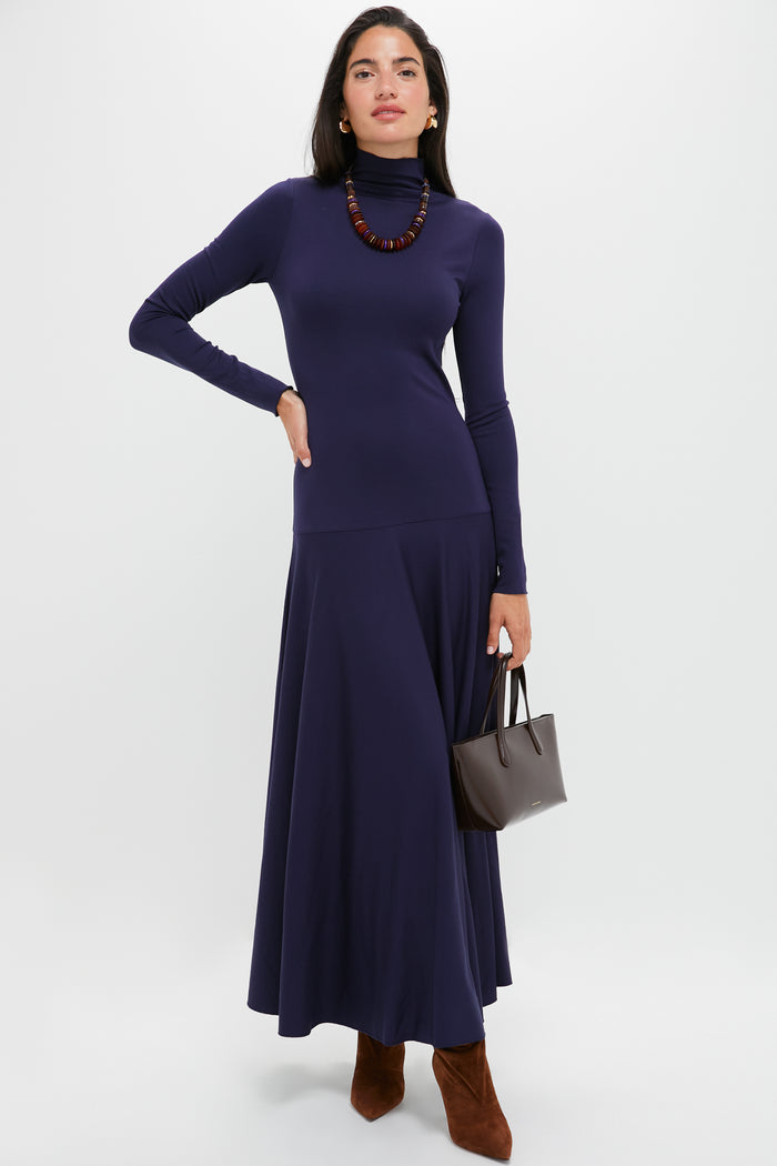 Model in a navy turtleneck dress, styled with the Multi Amaranth Necklace's earthy elegance, accessorized for an effortless, classic, and high-end look.