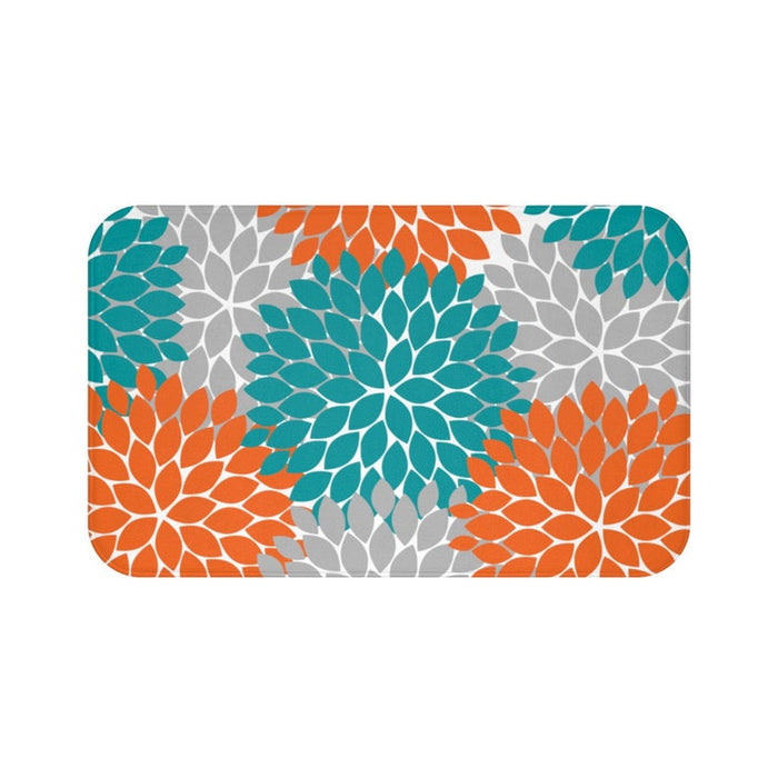 Orange, teal, and gray flower petal burst pattern on a memory foam mat.