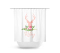 Image of a shower curtain with a pink deer head silhouette on top of a floral arrangement with green leaves and pink   flowers. A personalized name, in pink cursive-style letters is below the deer head.