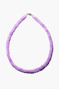 Theodosia necklace featuring round, translucent lavender beads and a gold-fill clasp, exemplifying handcrafted fine jewelry.
