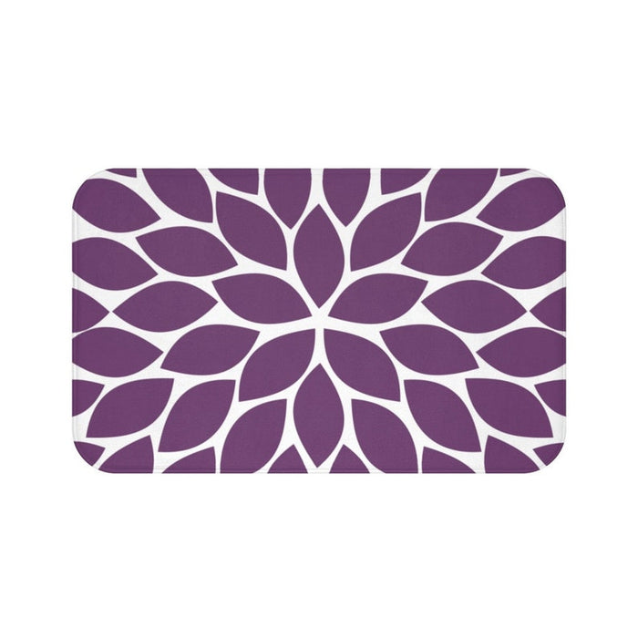 Memory foam floor mat with a single flower petal burst design in purple with a white background. The center flower petals form a star pattern with all the other flower petals bursting out from the center.