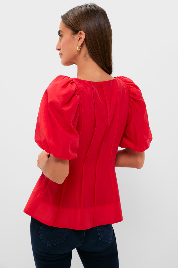 Ruby Taffeta Annalise Blouse showcases a classic, effortless style with puff sleeves and vertical seams, perfect for a fun, high-end look.