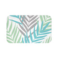 Palm leave pattern on a white background on a memory foam mat