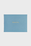 Graphic Image blue leather guest book with "GUESTS" embossed in gold on the cover—ideal for weddings or as a personalized leather gift.