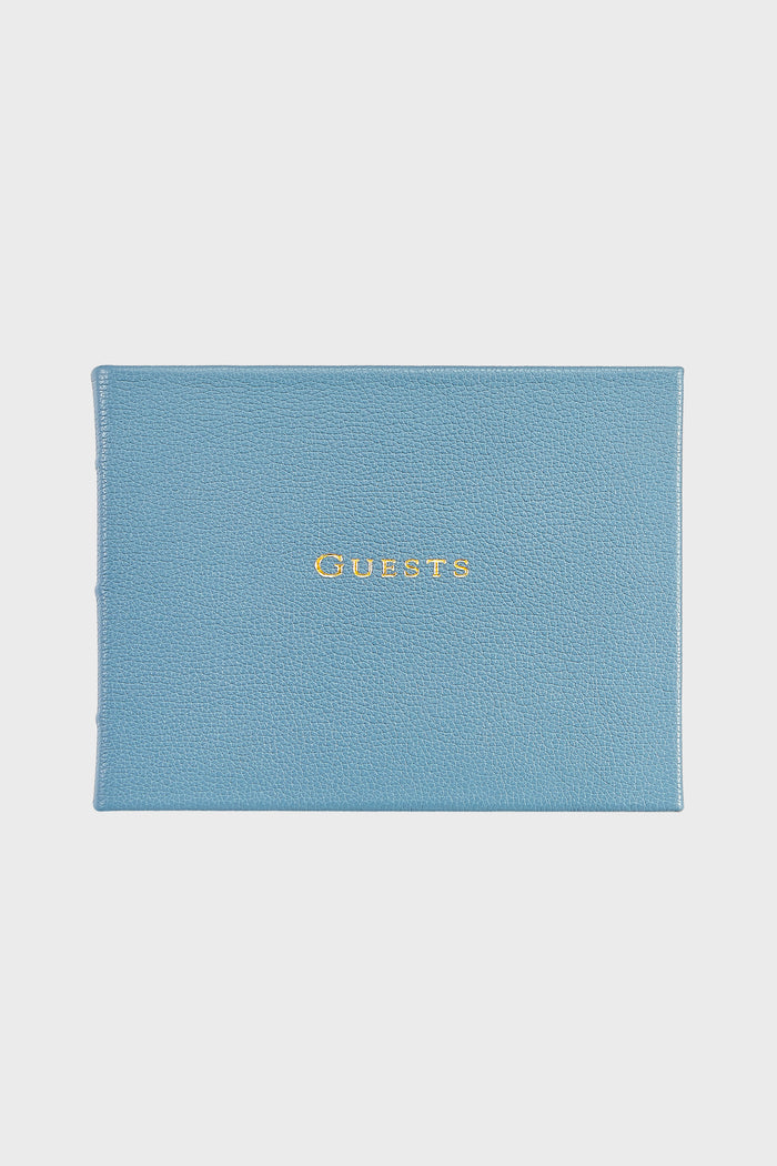 Graphic Image blue leather guest book with "GUESTS" embossed in gold on the cover—ideal for weddings or as a personalized leather gift.
