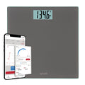 Gray glass smart scale with a large digital weight readout in pounds