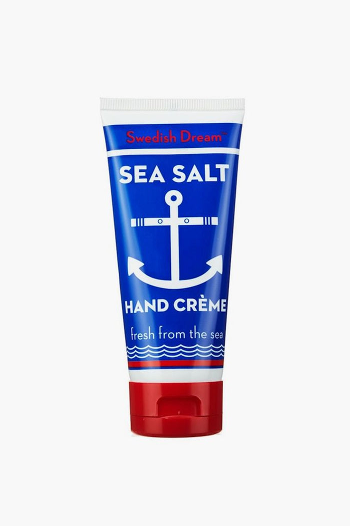 Swedish Dream Sea Salt Hand Creme in a classic blue tube with red cap, offering effortless, fun, high-end hydration with a crisp, ocean-inspired scent.