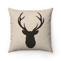 Tan pillow with dark brown silhouette of a deer buck head with antlers.
