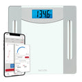 Taylor smart weight tracking scale with a blue backlit display and a phone showing the Precision Hub app