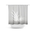 Gray shower curtain with a white seaweed design on it, hanging in a bathroom.