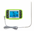 Green TruTemp wired programmable thermometer with presets and a long gray probe cord on a white kitchen surface